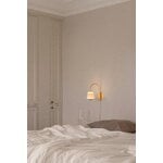 Nuura Asteea wall lamp, satin brass - ripple clear, decoration image