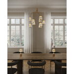 Nuura Asteea portable table lamp, satin brass - ripple clear, decoration image