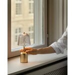Nuura Asteea portable table lamp, satin brass - ripple clear, decoration image