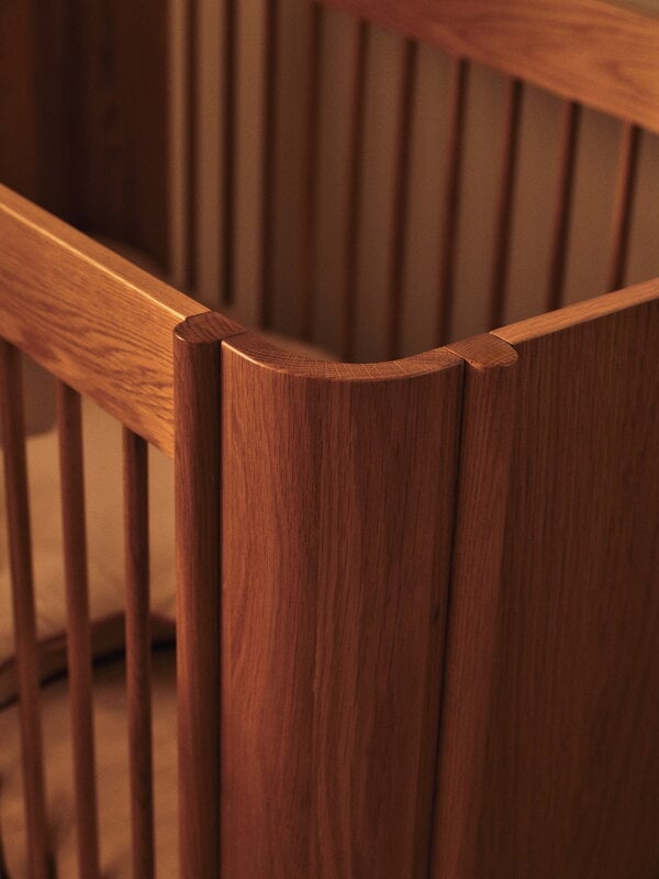 Ferm Living Tilu baby cot, natural oak, decoration image