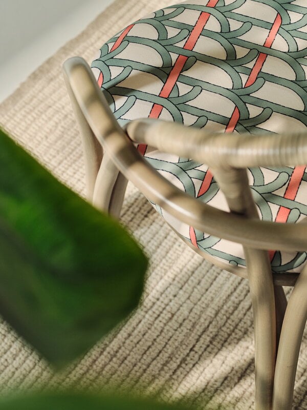 GUBI Bistra dining armchair, olive stained rattan - Reales Pattern 001, decoration image