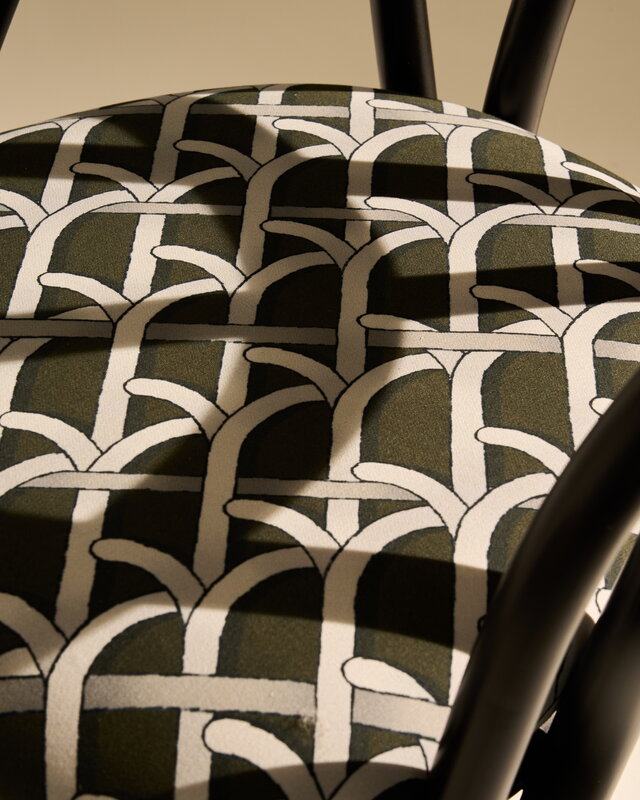 GUBI Bistra dining armchair, ebony painted rattan - Reales Pattern 003, decoration image