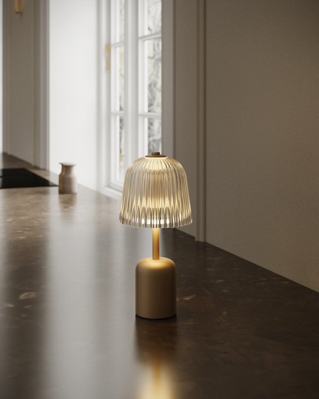 Nuura Asteea portable table lamp, satin brass - ripple clear, decoration image